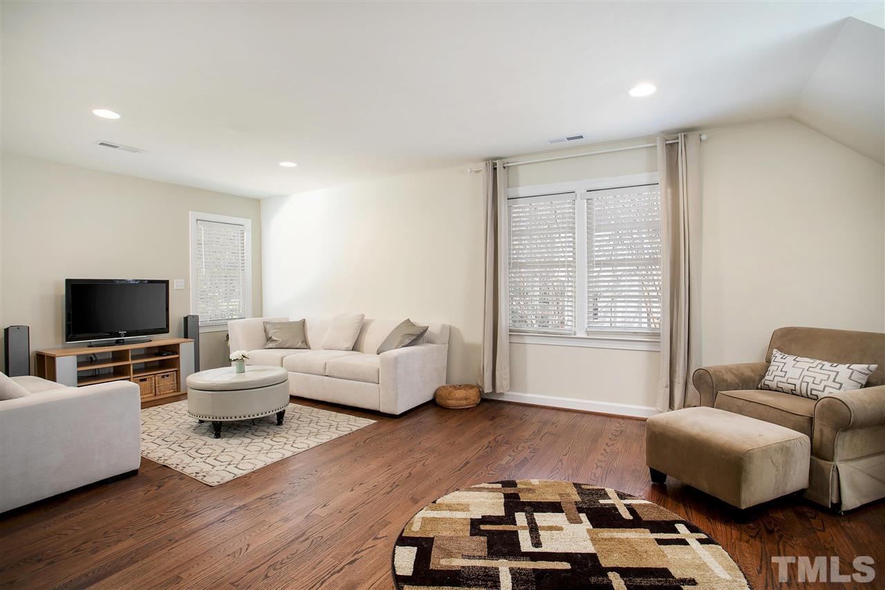 7102 Spring Ridge Road Cary, NC 27518 - Photo 20 of 25 THE IDEAL BONUS ROOM - OR USE IT AS A 4TH BEDROOM IF NEEDED! HUGE, SO MANY WINDOWS, BIG CLOSET AND THE HARDWOODS HERE TOO!
