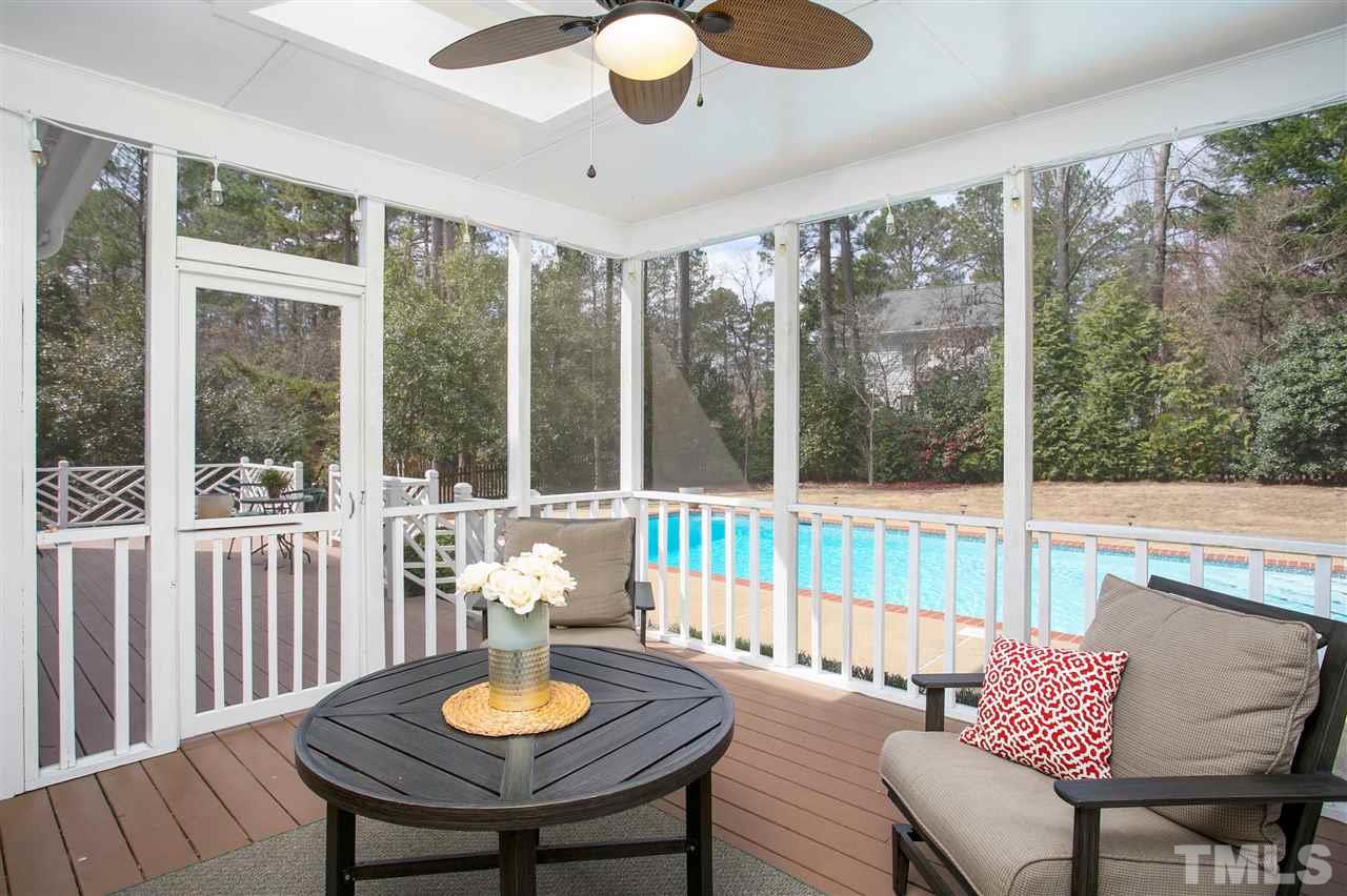 7102 Spring Ridge Road Cary, NC 27518 - Photo 24 of 25 WE CAN'T THINK OF A MORE PERFECT SETTING THAN WHAT YOU SEE RIGHT HERE...SITTING IN YOUR FABULOUS SCREENED PORCH SIPPING ON "SOMETHING" WHILE VIEWING FRIENDS PLAYING IN THE POOL OR KIDS KICKING A BALL IN THE YARD!