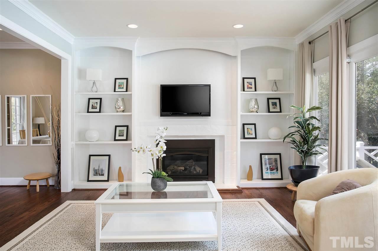 7102 Spring Ridge Road Cary, NC 27518 - Photo 6 of 25 JUST LOOK AT THE RICH HARDWOOD FLOORS, CUSTOM BUILT INS AND FABULOUS GAS LOG FIRE PLACE! THE WINDOWS FACING YOUR PRIVATE BACK YARD AND THE POOL ARE SHOW STOPPERS!