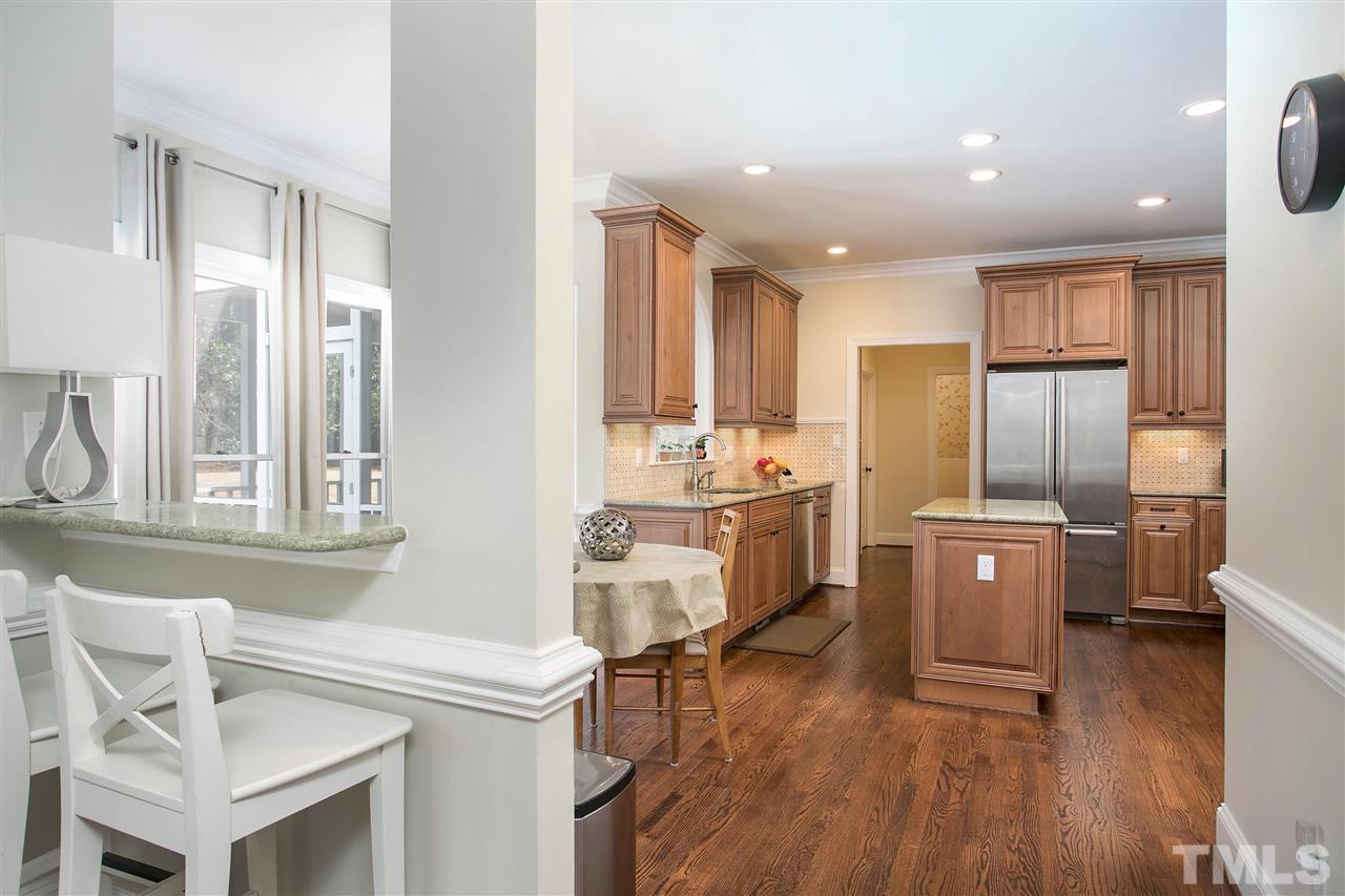 7102 Spring Ridge Road Cary, NC 27518 - Photo 9 of 25 LOVE THIS BAR FEATURE! GREAT FOR ENTERTAINING OR USING FOR YOUR DAILY "DROP" AREA! NOTICE THE FANTASTIC FLOORS, CHAIR RAIL AND RECESSED LIGHTING TOO!