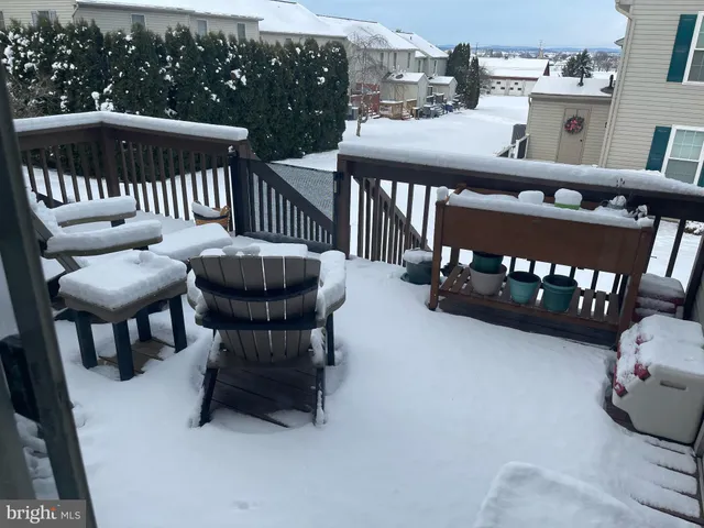 a view of a patio with a table and chairs
