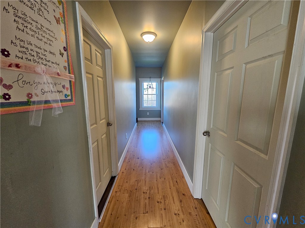 3814 South Constitution Route Dillwyn, VA 23936 - Photo 15 of 42 a view of a hallway with wooden floor