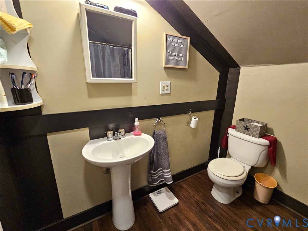 3814 South Constitution Route Dillwyn, VA 23936 - Photo 17 of 42 a bathroom with a toilet sink and mirror