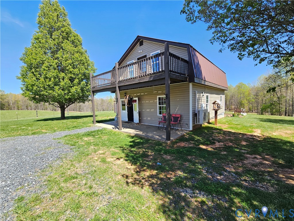 3814 South Constitution Route Dillwyn, VA 23936 - Photo 2 of 49 a view of a big house with a big yard and large trees