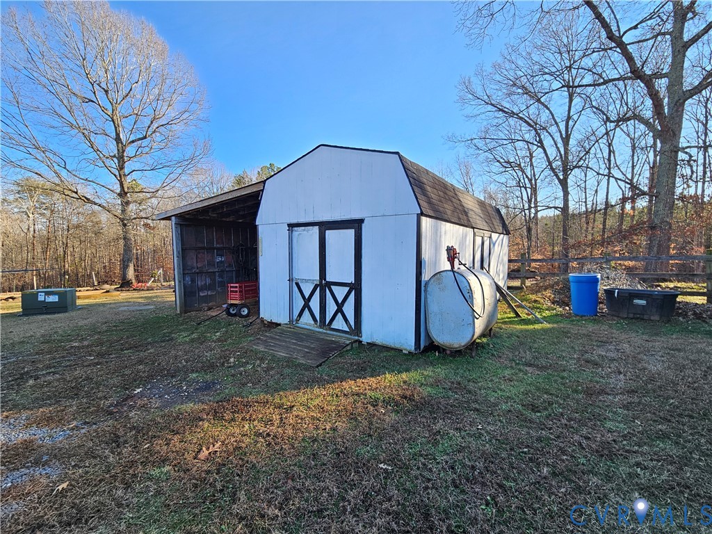 3814 South Constitution Route Dillwyn, VA 23936 - Photo 29 of 42 a view of a house with a yard and a large tree