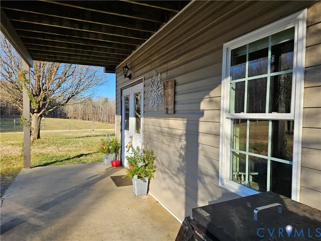 a view of a porch with potted plants