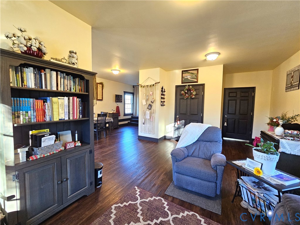 3814 South Constitution Route Dillwyn, VA 23936 - Photo 9 of 42 a living room with furniture and a book shelf