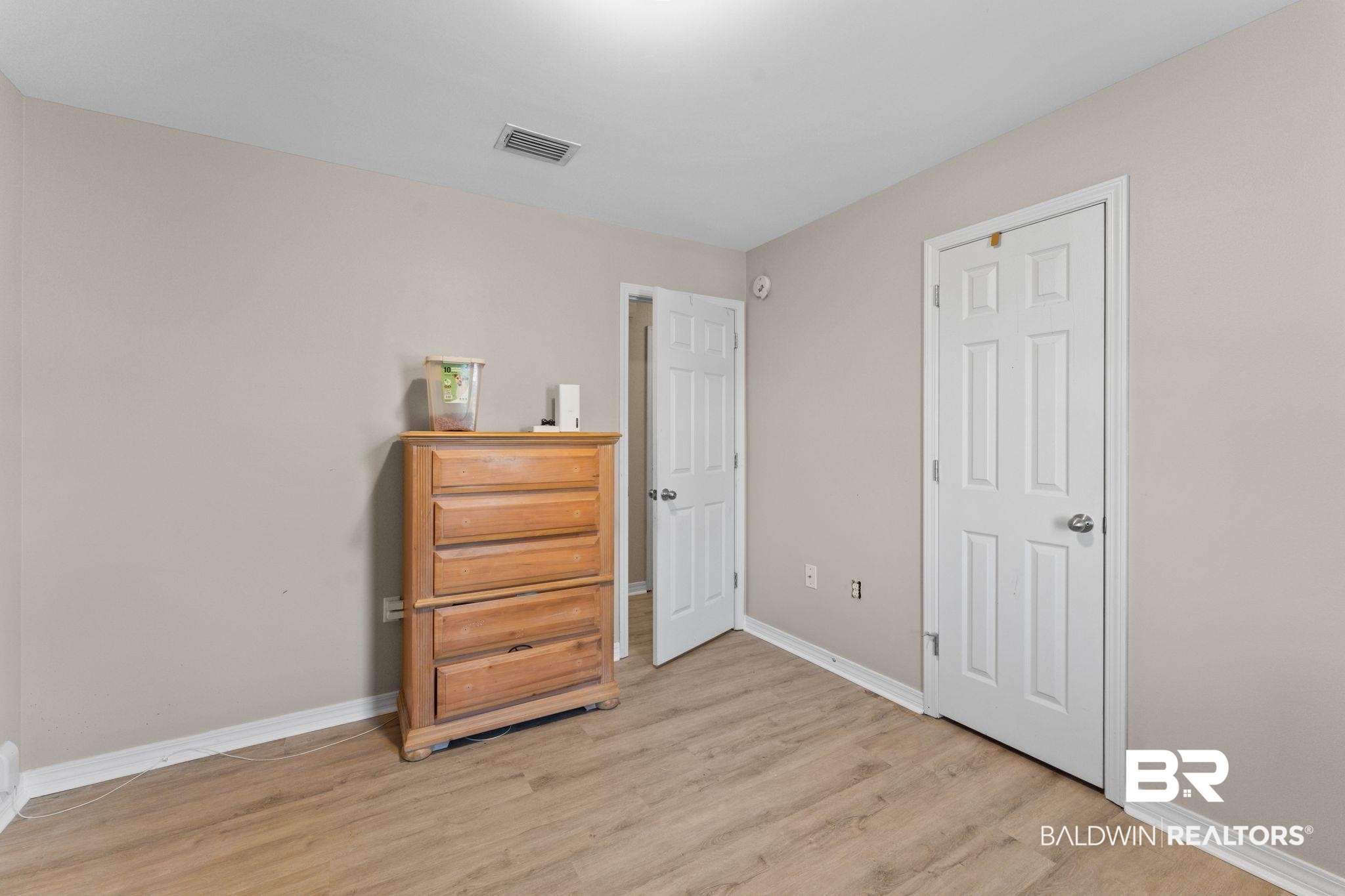 1549 Majesty Loop Foley, AL 36535 - Photo 16 of 25 Living area with baseboards and light wood-type flooring