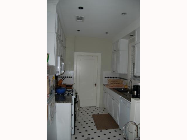 3106 Walling Drive Austin, TX 78705 - Photo 13 of 30 a kitchen with a sink and a stove top oven