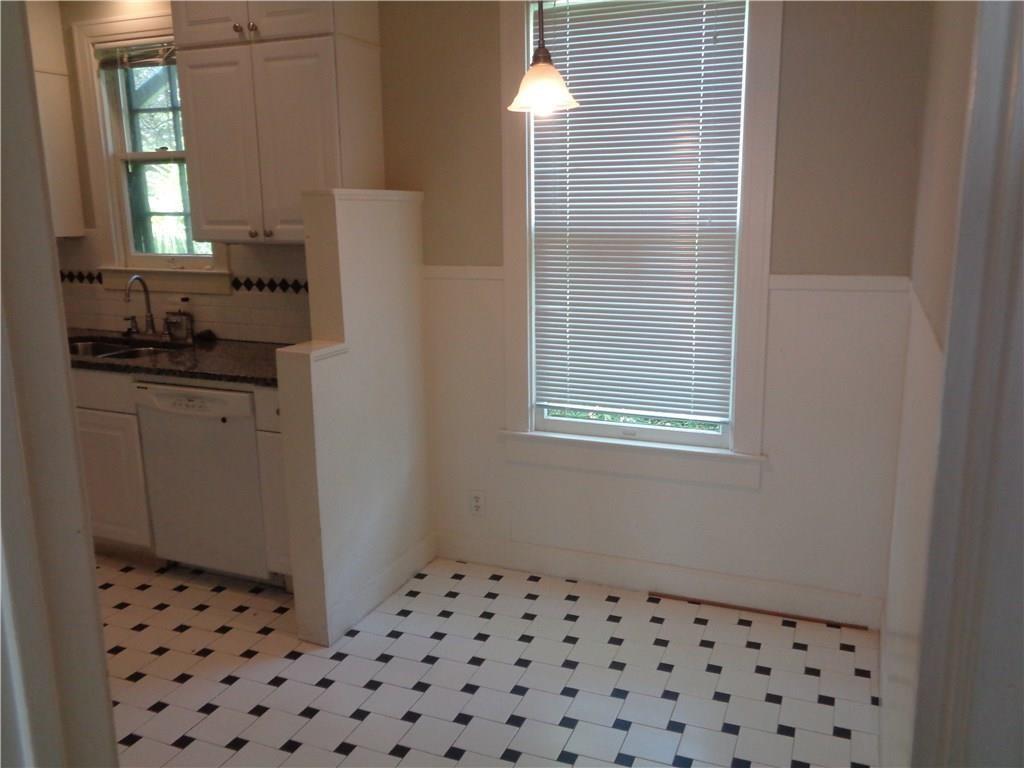 3106 Walling Drive Austin, TX 78705 - Photo 14 of 30 a bathroom with a sink a vanity and a mirror