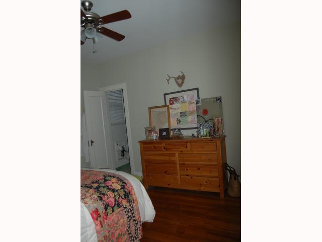 3106 Walling Drive Austin, TX 78705 - Photo 19 of 30 a bed room with a bed and a dresser