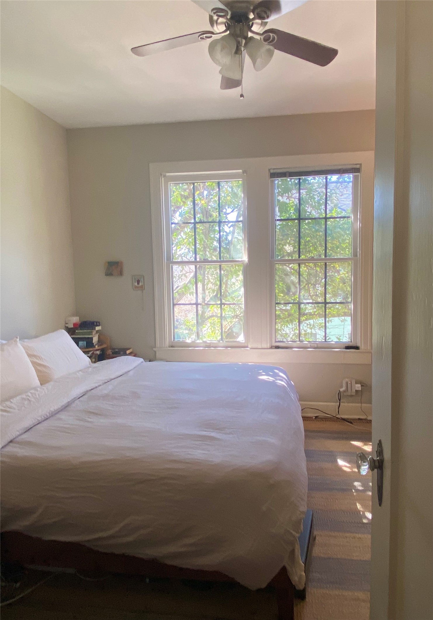 3106 Walling Drive Austin, TX 78705 - Photo 20 of 30 a bedroom with a bed and window