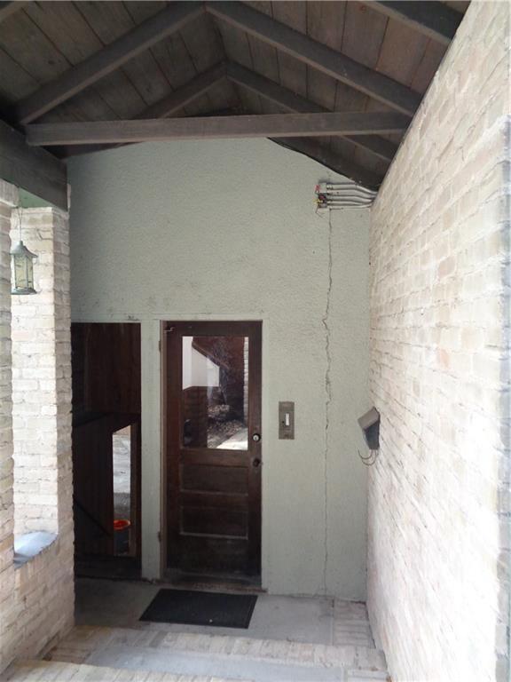 3106 Walling Drive Austin, TX 78705 - Photo 2 of 30 a view of a hallway with wooden floor and staircase
