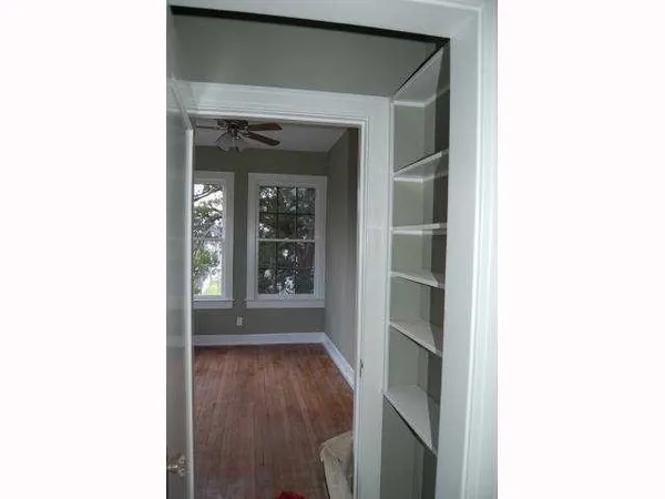 a view of an entryway with wooden floor