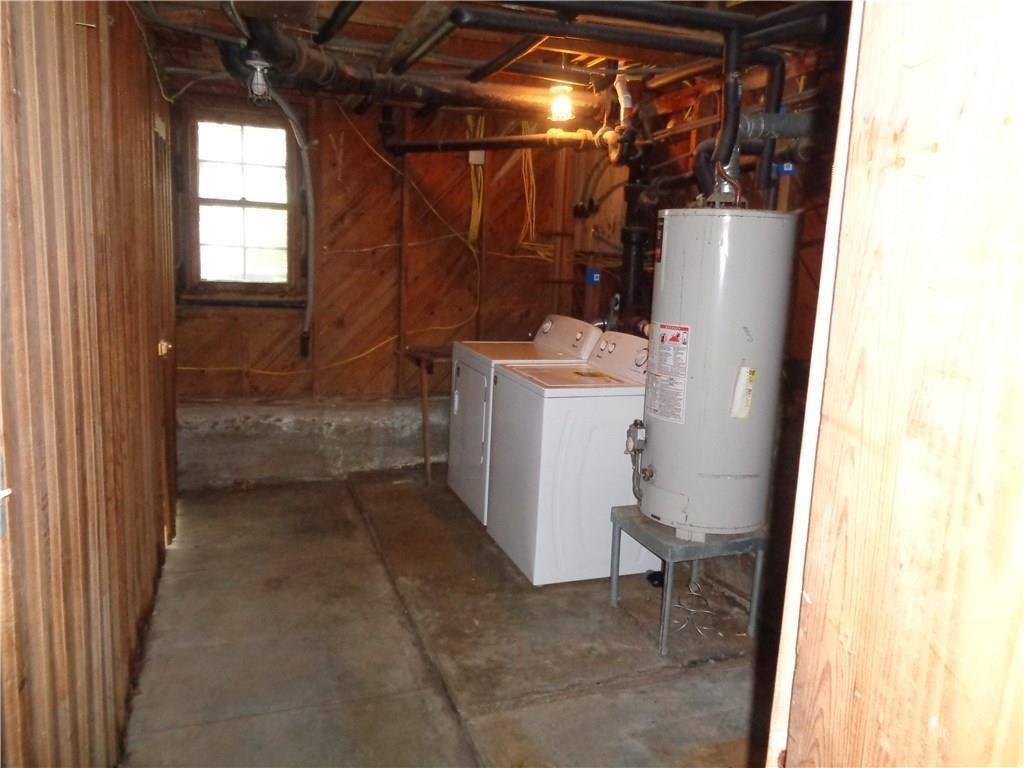 3106 Walling Drive Austin, TX 78705 - Photo 27 of 30 a view of a storage & utility room with a sink