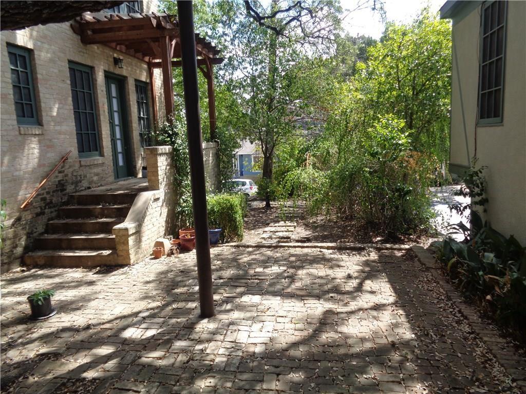 3106 Walling Drive Austin, TX 78705 - Photo 29 of 30 a view of a house with backyard and trees