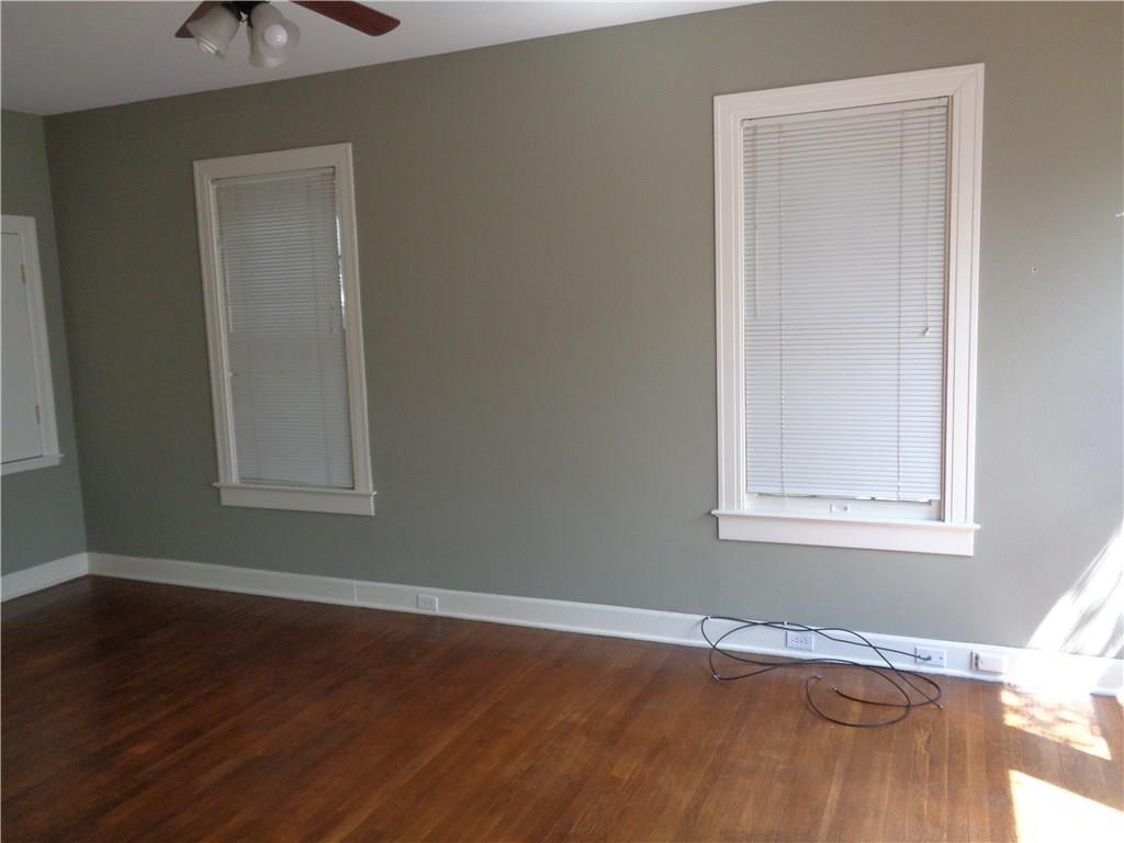 3106 Walling Drive Austin, TX 78705 - Photo 4 of 30 an empty room with wooden floor and windows