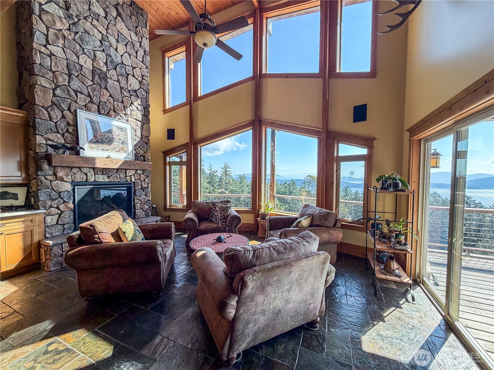 726 Pine Ridge Drive Orcas Island, WA 98280 - Photo 11 of 40 a living room with furniture fireplace and a large window