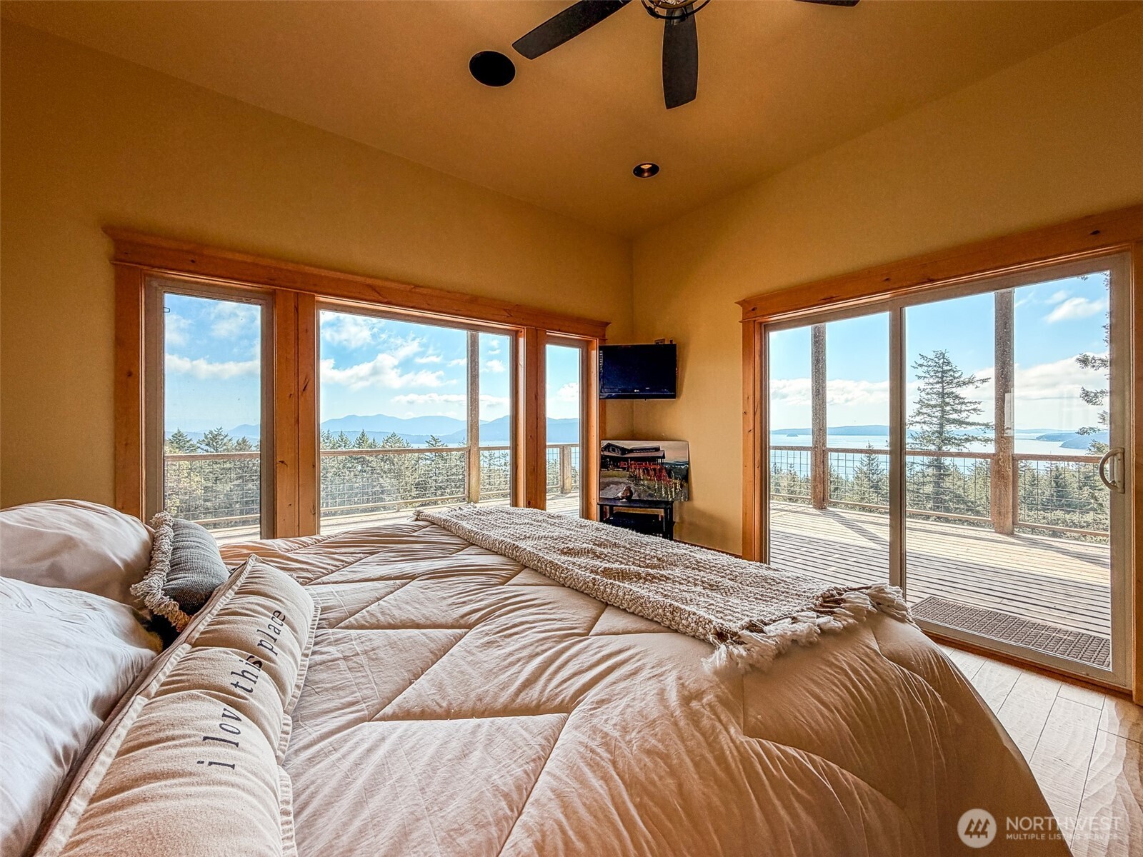 726 Pine Ridge Drive Orcas Island, WA 98280 - Photo 13 of 40 a bedroom with a bed and a large window with outer view