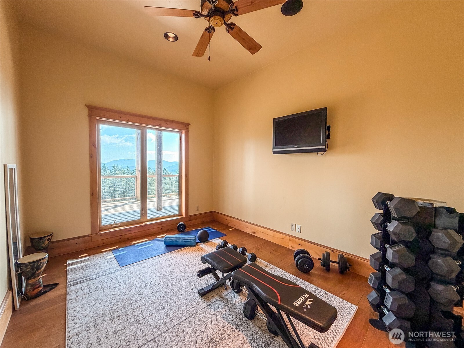 726 Pine Ridge Drive Orcas Island, WA 98280 - Photo 17 of 40 a room with furniture and flat screen tv