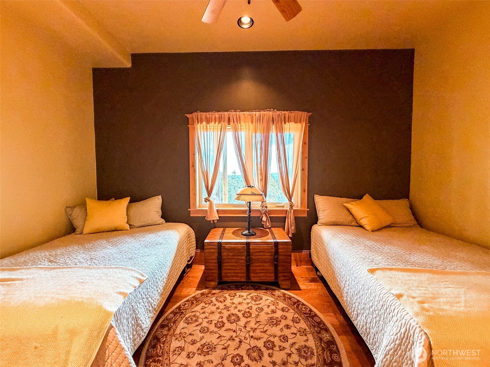 726 Pine Ridge Drive Orcas Island, WA 98280 - Photo 18 of 40 a bedroom with a bed and wooden floor