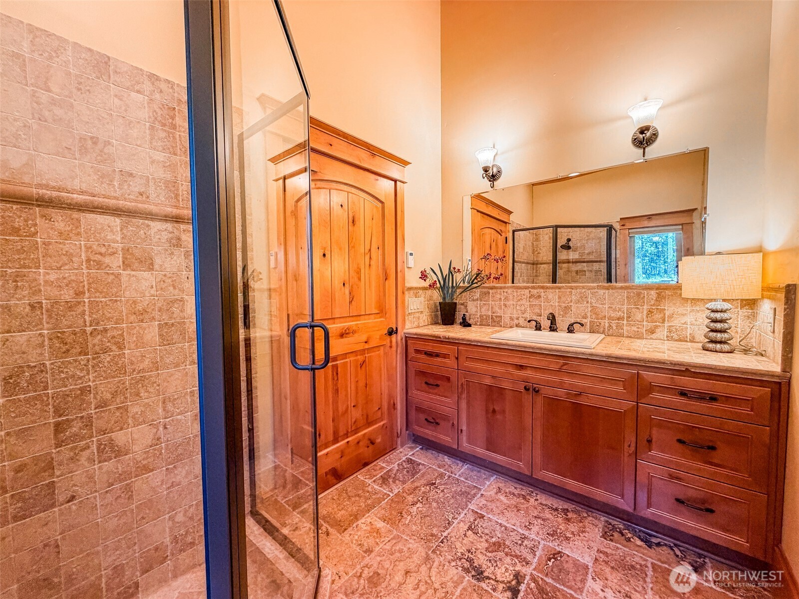 726 Pine Ridge Drive Orcas Island, WA 98280 - Photo 27 of 40 a bathroom with a sink a mirror and a shower
