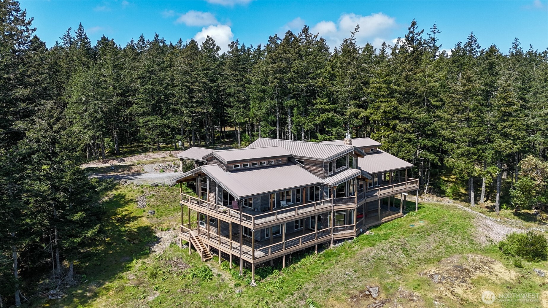 726 Pine Ridge Drive Orcas Island, WA 98280 - Photo 36 of 40 an aerial view of a house with balcony and trees al around