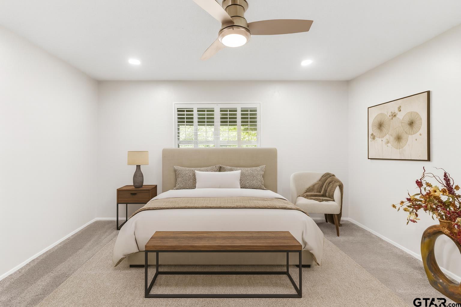 109 King Lyle Road Scroggins, TX 75480 - Photo 15 of 46 a bedroom with bed and a chandelier