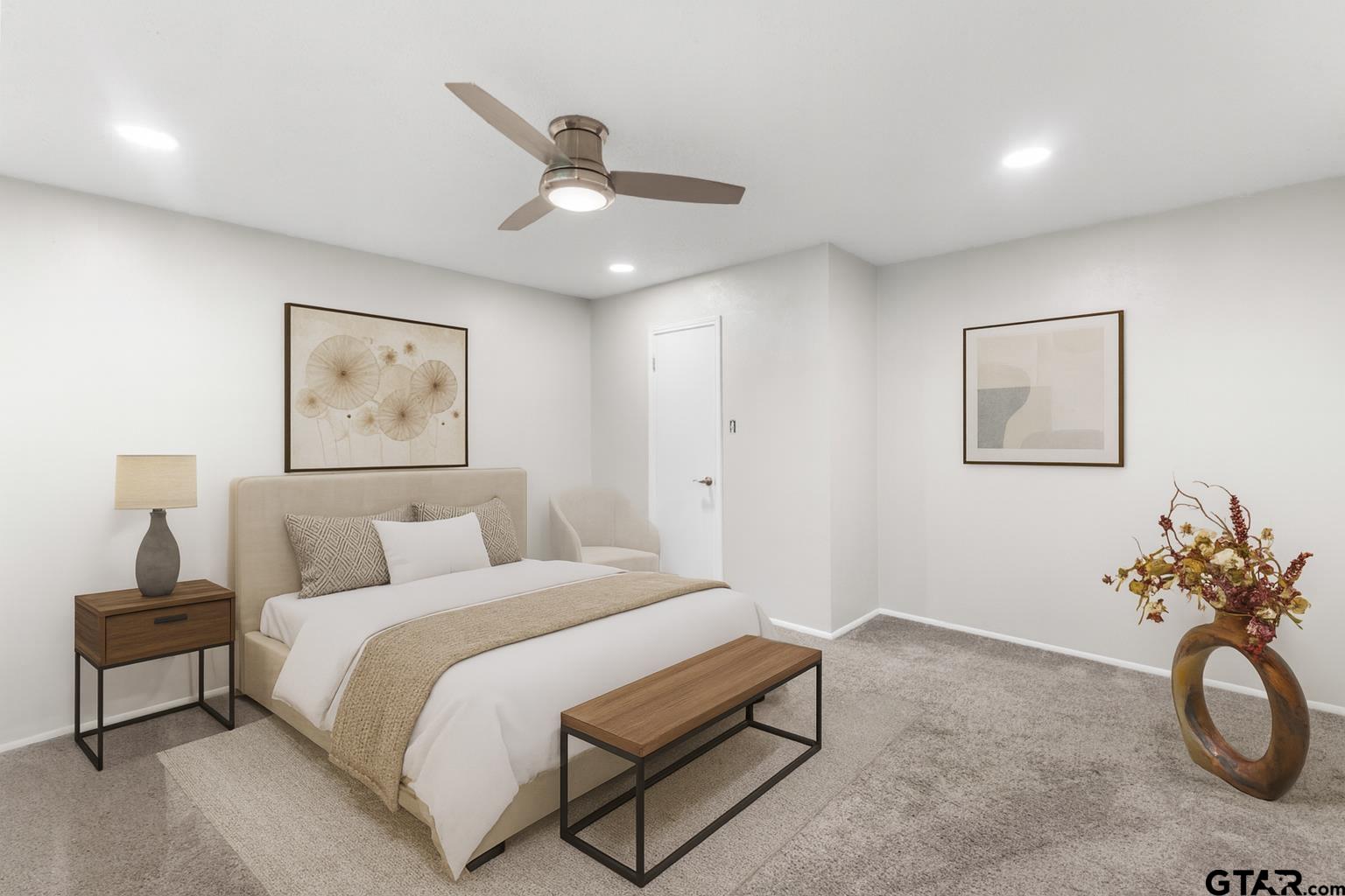 109 King Lyle Road Scroggins, TX 75480 - Photo 16 of 46 a bedroom with a bed and painting on the wall