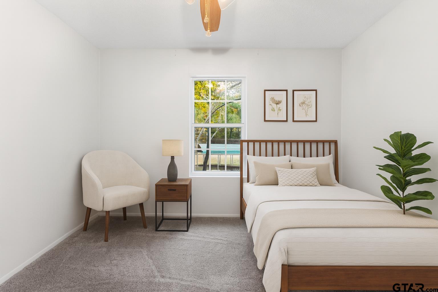 109 King Lyle Road Scroggins, TX 75480 - Photo 20 of 46 a bedroom with a bed and a chair