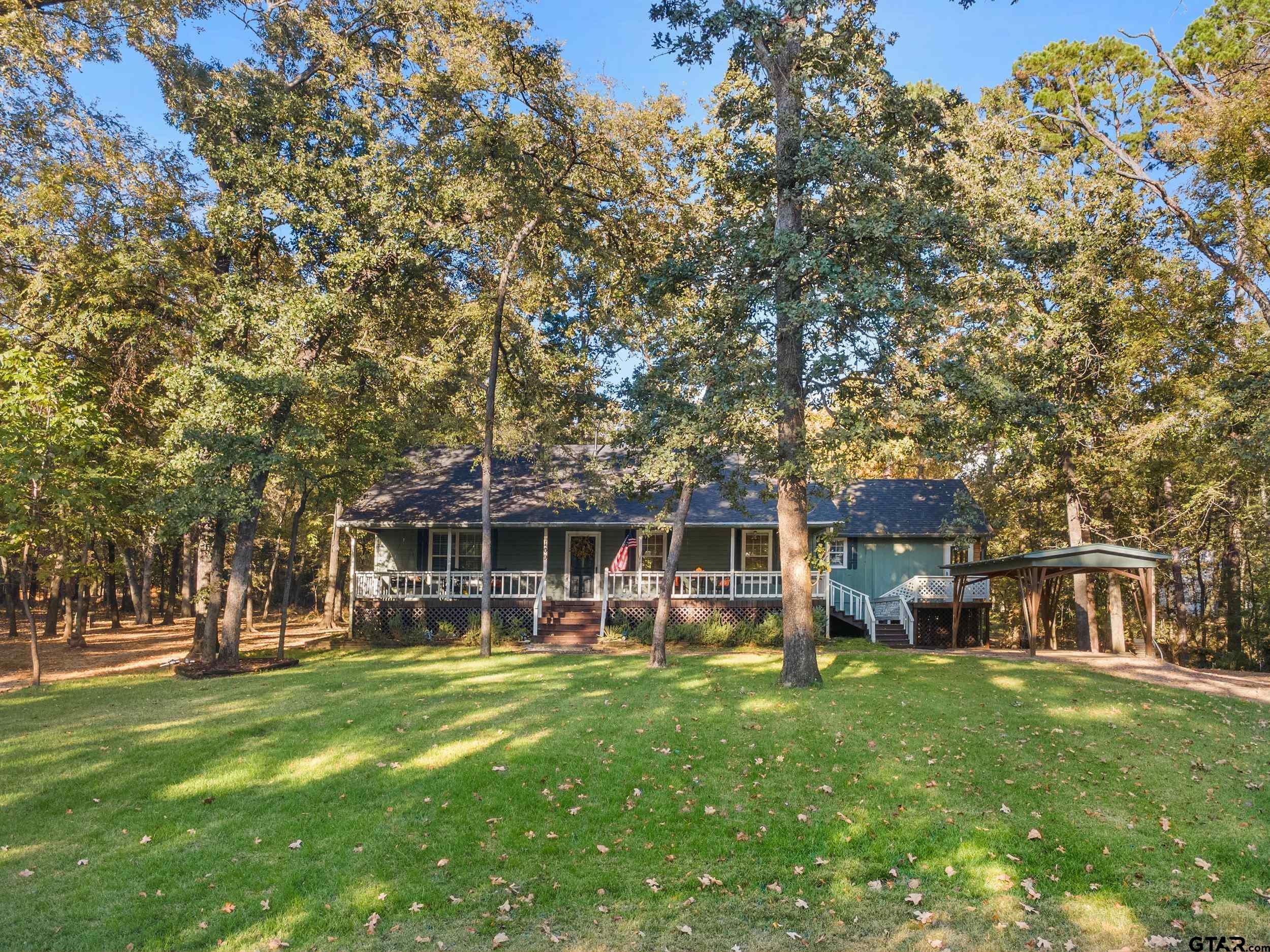 109 King Lyle Road Scroggins, TX 75480 - Photo 2 of 46 a view of a house with a backyard porch and sitting area