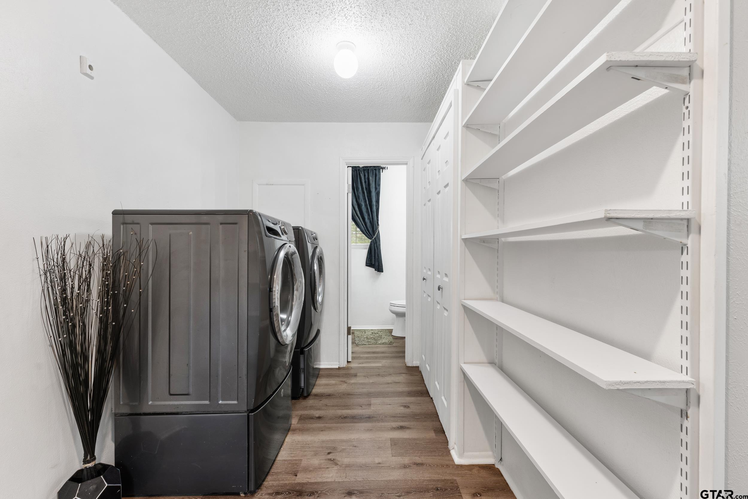 109 King Lyle Road Scroggins, TX 75480 - Photo 22 of 46 a view of walk in closet with clothes and shoes