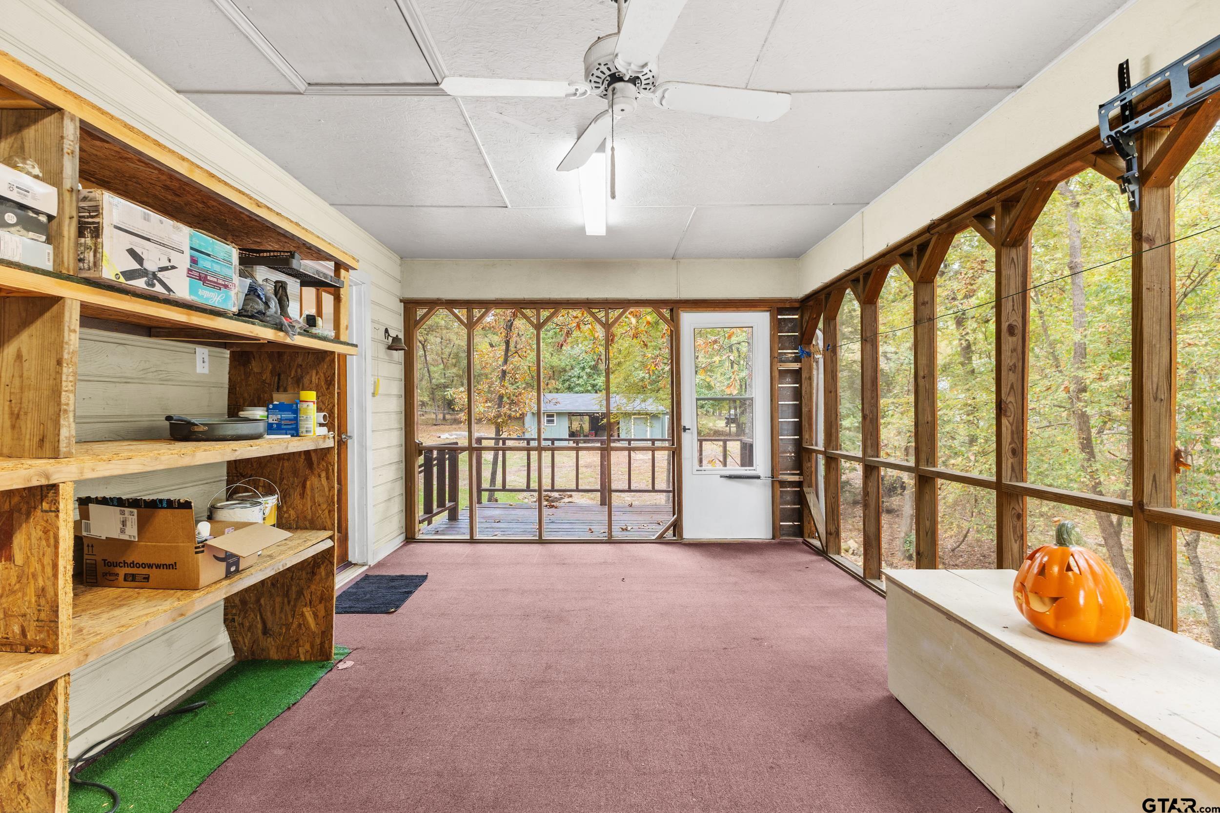 109 King Lyle Road Scroggins, TX 75480 - Photo 30 of 46 a spacious bedroom with a large bed and a large window