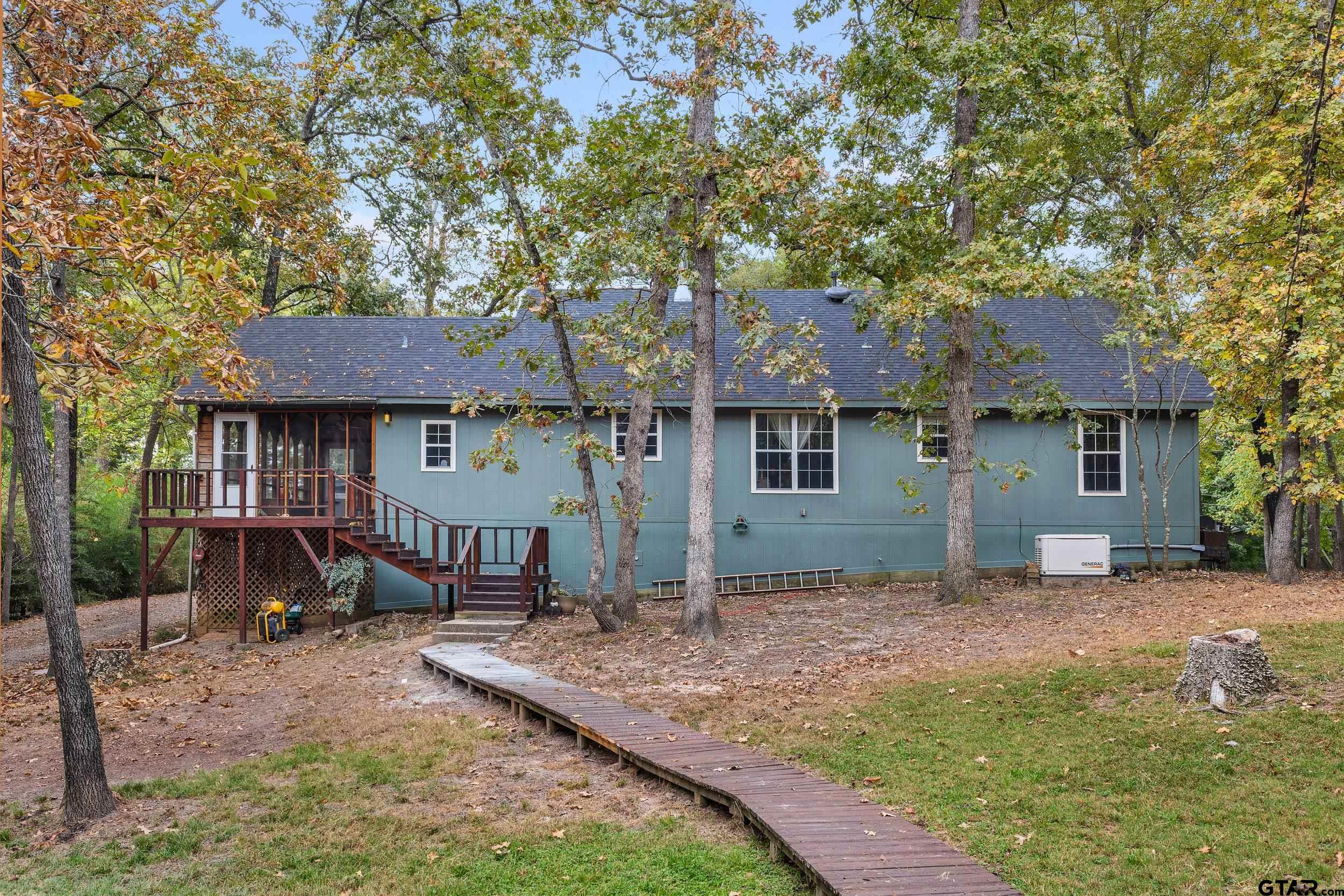 109 King Lyle Road Scroggins, TX 75480 - Photo 32 of 46 a front view of a house with garden