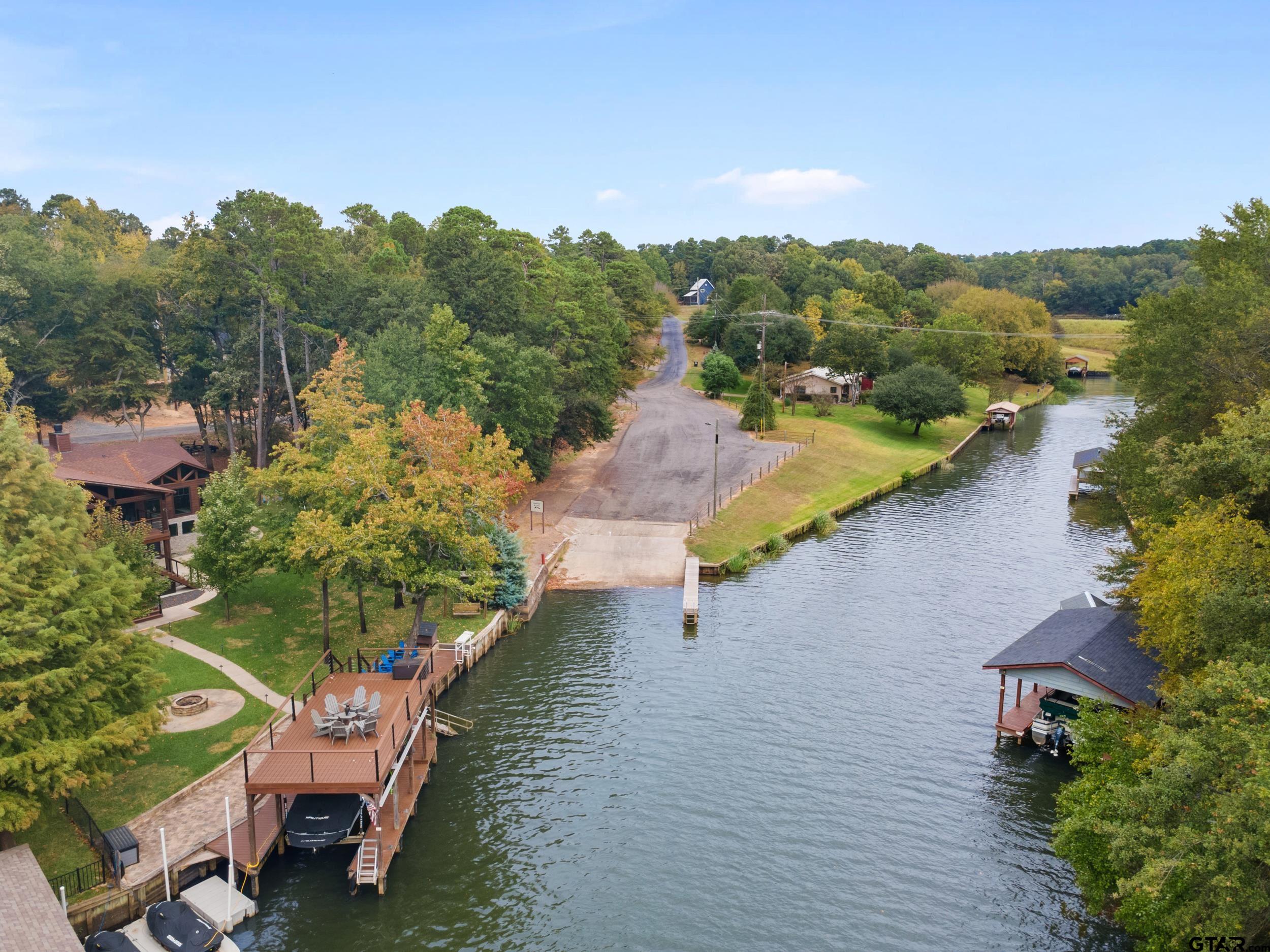 109 King Lyle Road Scroggins, TX 75480 - Photo 44 of 46 a view of a lake with a yard and mountain view
