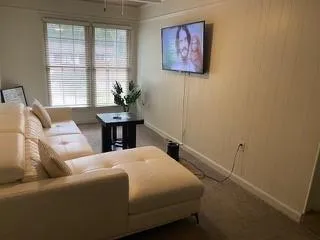 a bedroom with a bed and a table