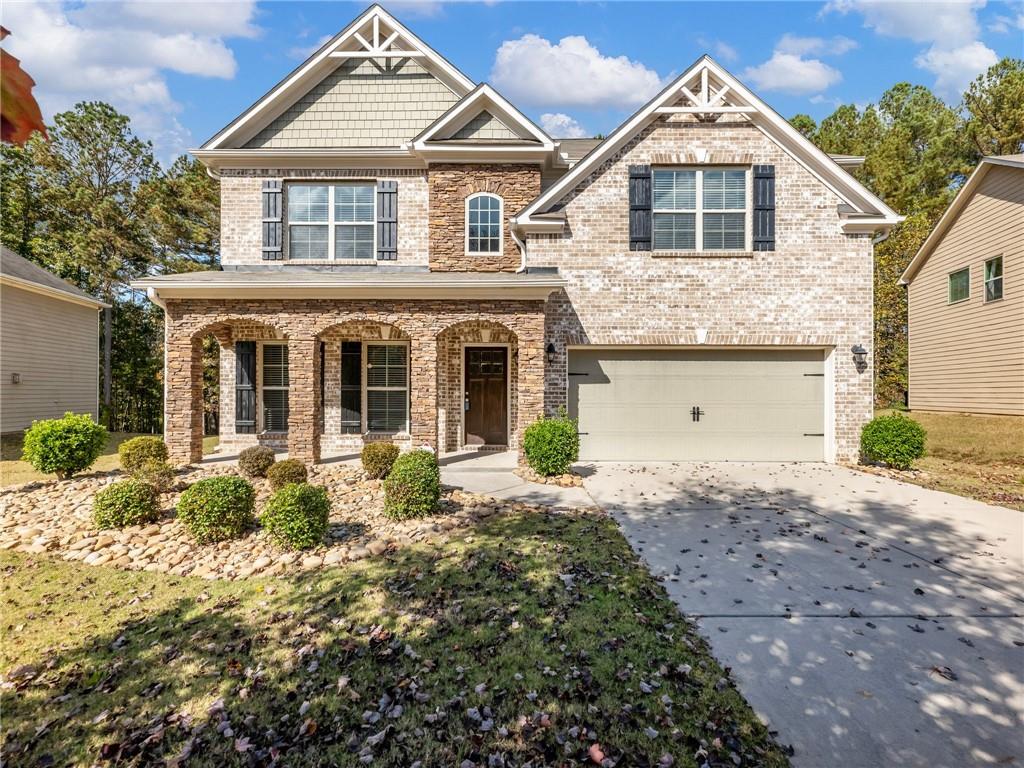 1237 Clear Stream Ridge Auburn, GA 30011 - Photo 1 of 1 a front view of a house with a yard