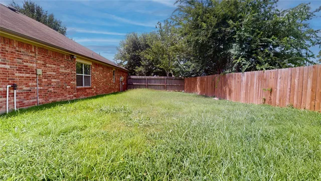 a view of backyard with green space