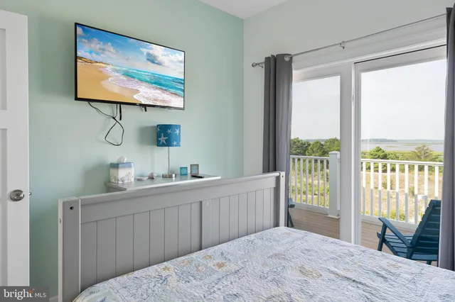 a bedroom with furniture a bed and a window