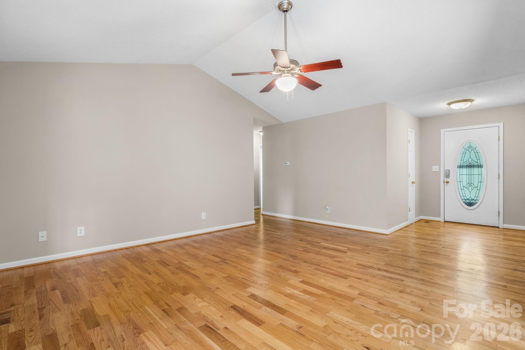 4967 Addison Lane Hickory, NC 28601 - Photo 7 of 43 an empty room with wooden floor fan and windows