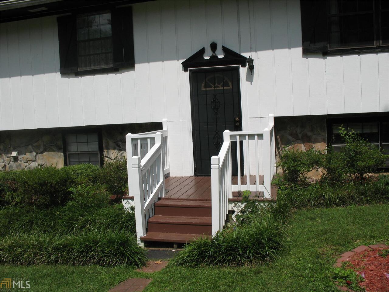 4526 Denise Drive, Unit /37 Decatur, GA 30035 - Photo 1 of 1 a front view of a house with a yard