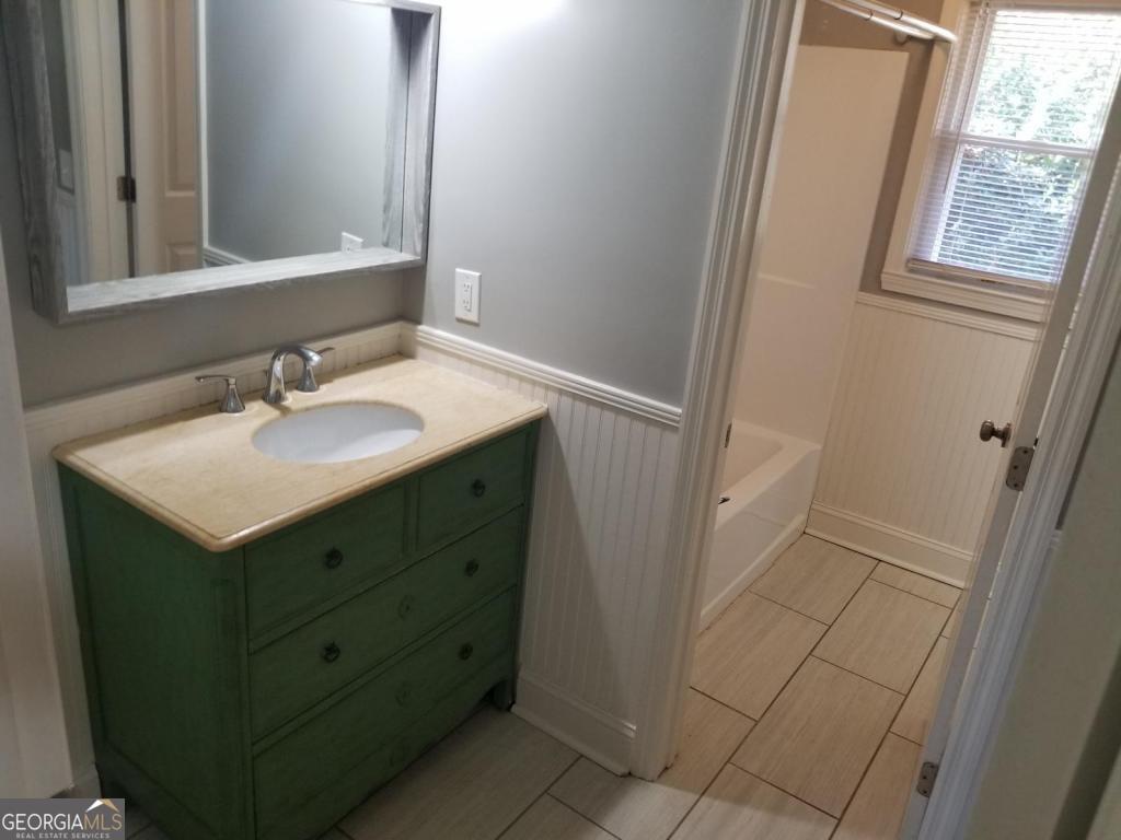 5003 Calhoun Road Northeast Adairsville, GA 30103 - Photo 7 of 11 a bathroom with a sink and a mirror