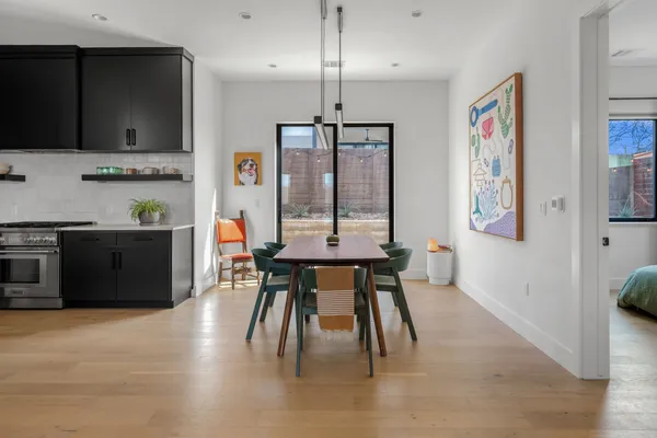 a dining room with furniture and window