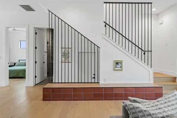 a view of bedroom with furniture and staircase