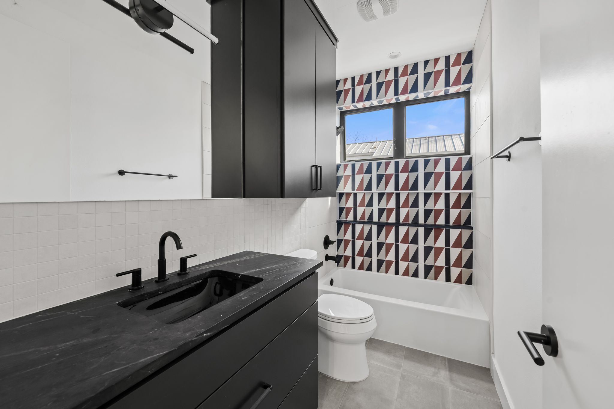 1301 Deloney Street Austin, TX 78721 - Photo 19 of 37 a bathroom with a sink toilet and shower