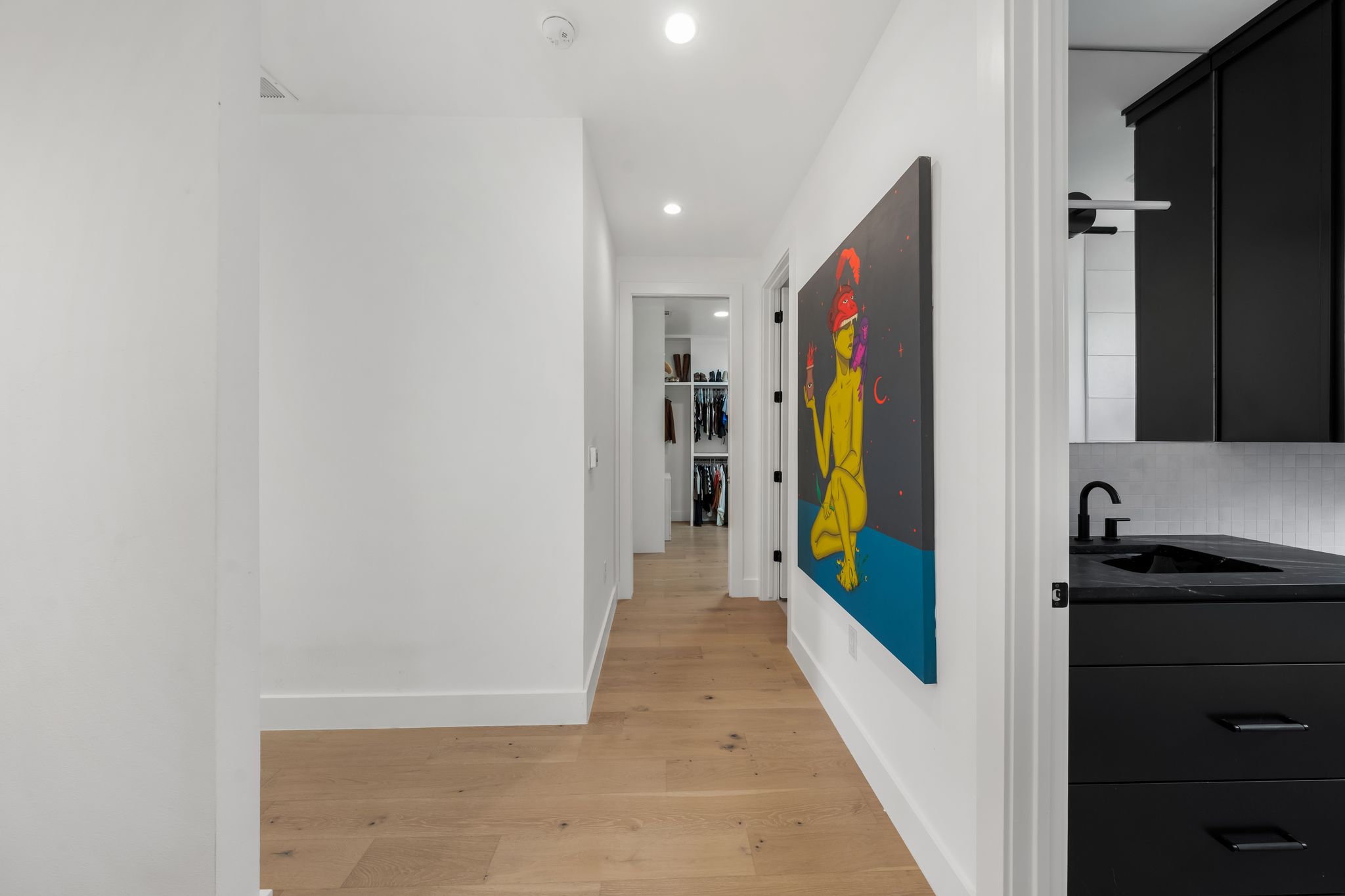 1301 Deloney Street Austin, TX 78721 - Photo 20 of 37 a view of a hallway with wooden floor and cabinet