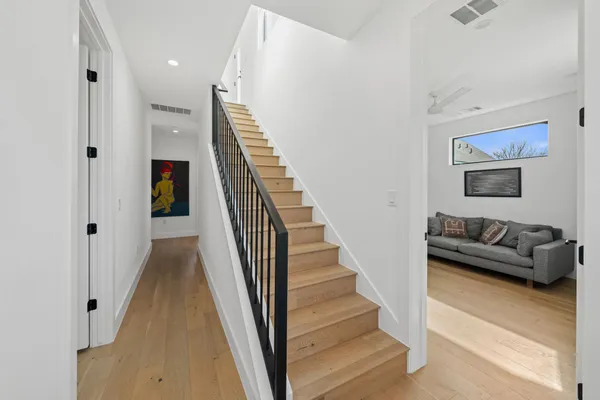 a view of a livingroom with furniture and stairs