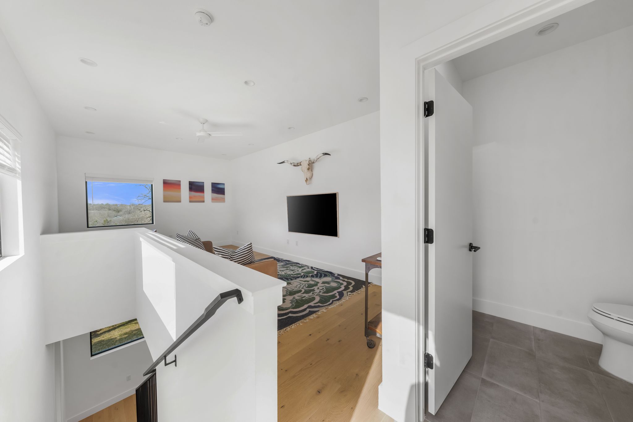 1301 Deloney Street Austin, TX 78721 - Photo 30 of 37 a living room with stainless steel appliances furniture and a kitchen view