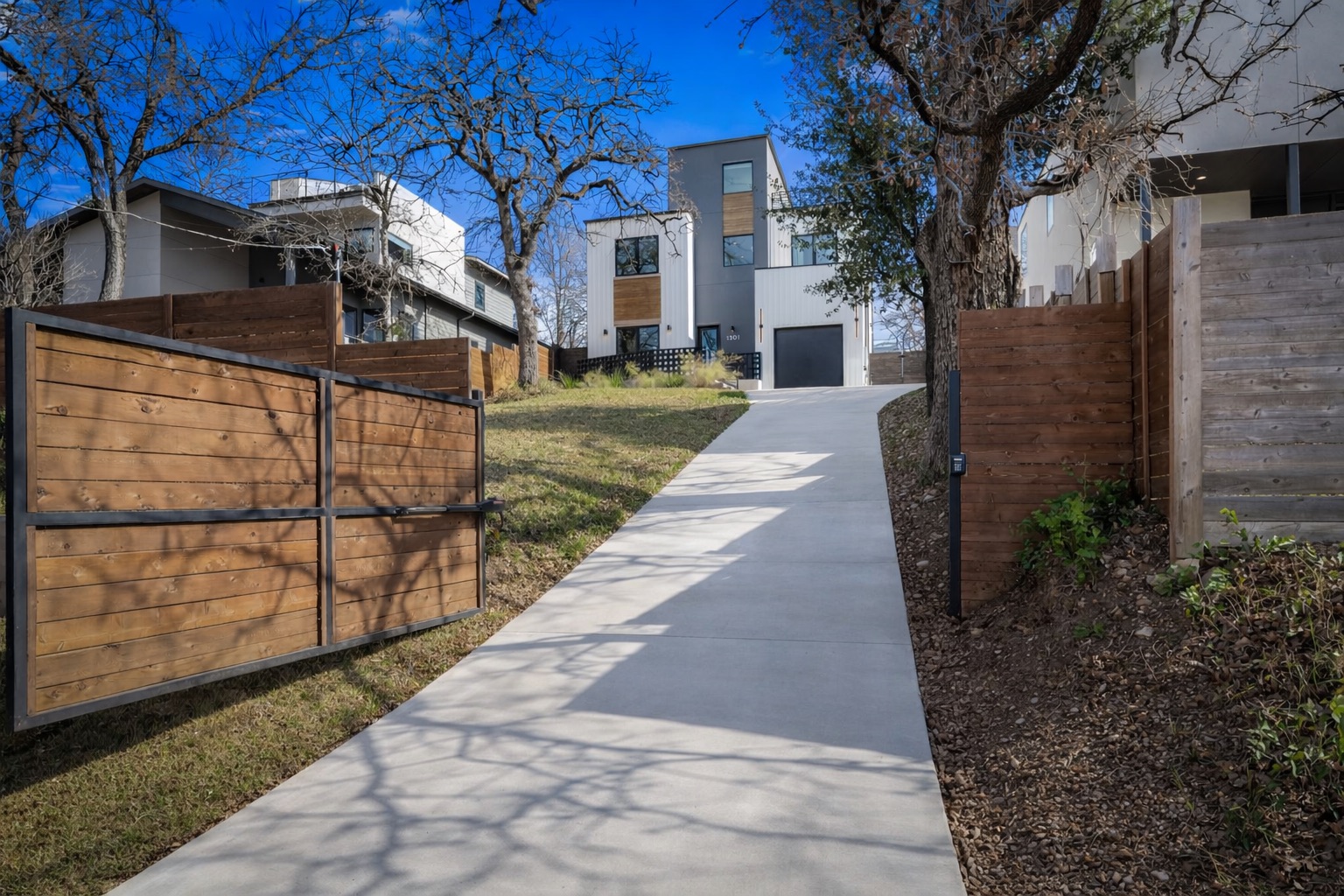 1301 Deloney Street Austin, TX 78721 - Photo 3 of 37 a view of a brick house with a large trees