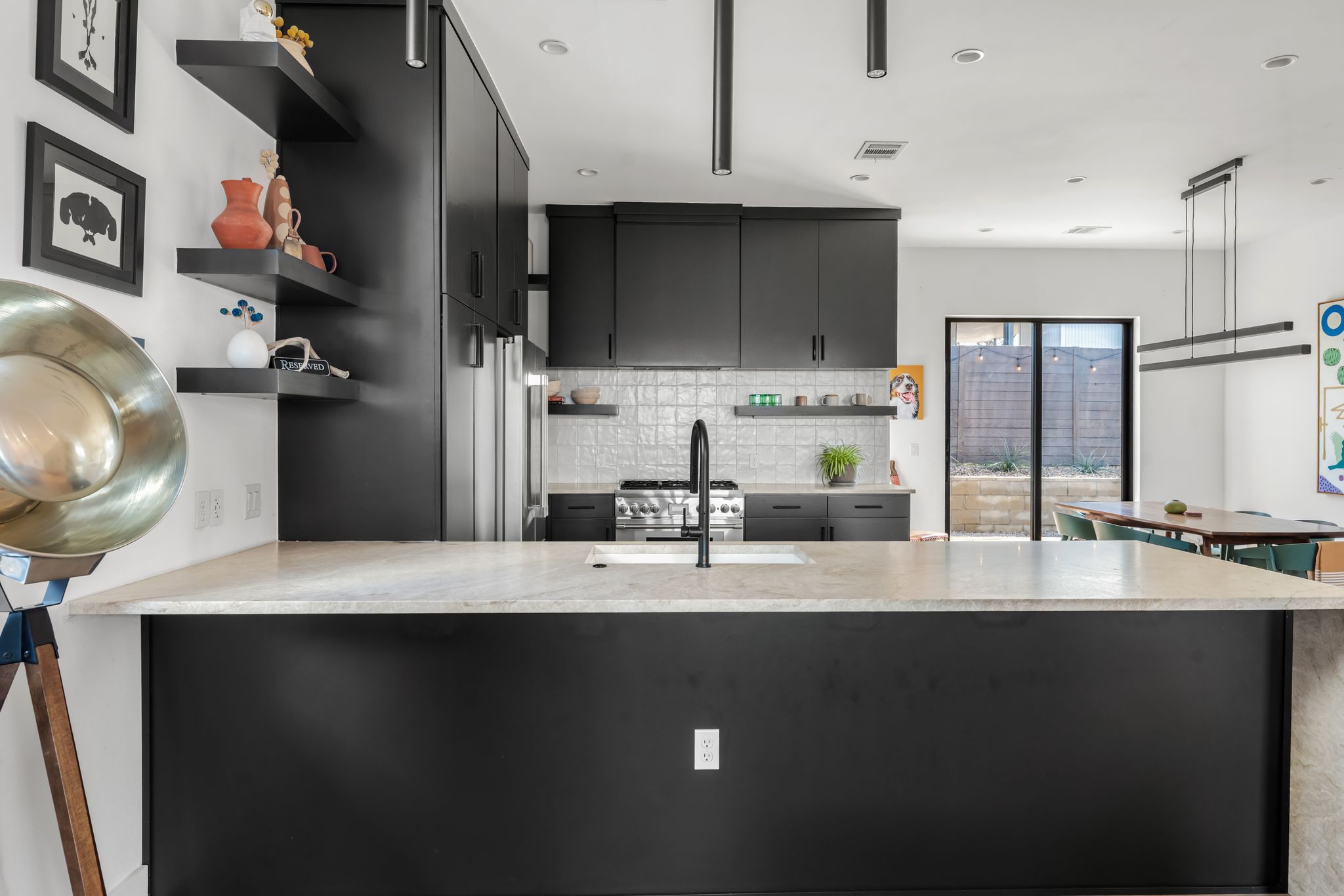 1301 Deloney Street Austin, TX 78721 - Photo 9 of 37 a kitchen with a sink stainless steel appliances and cabinets
